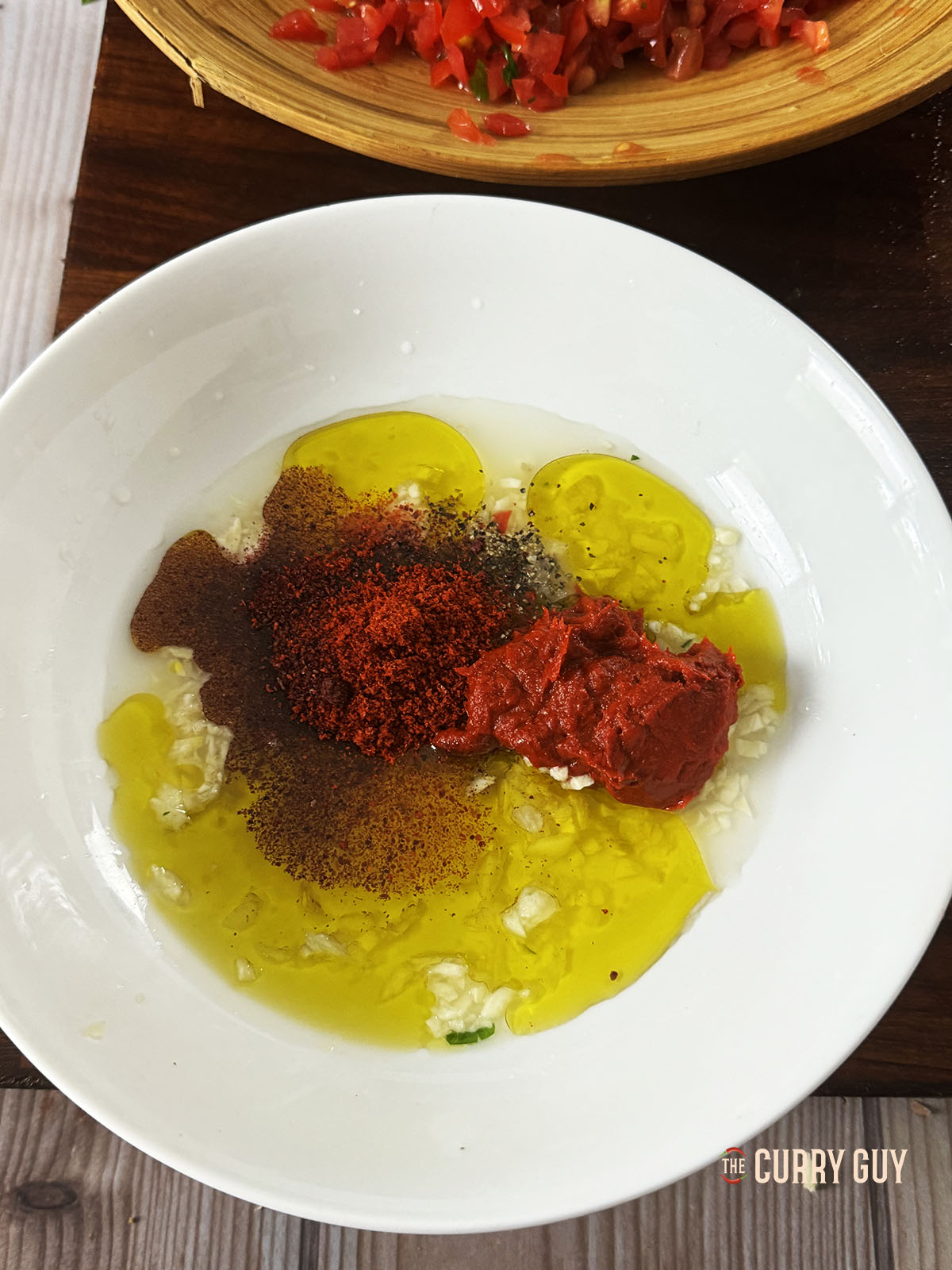 The dressing ingredients in a mixing bowl. 