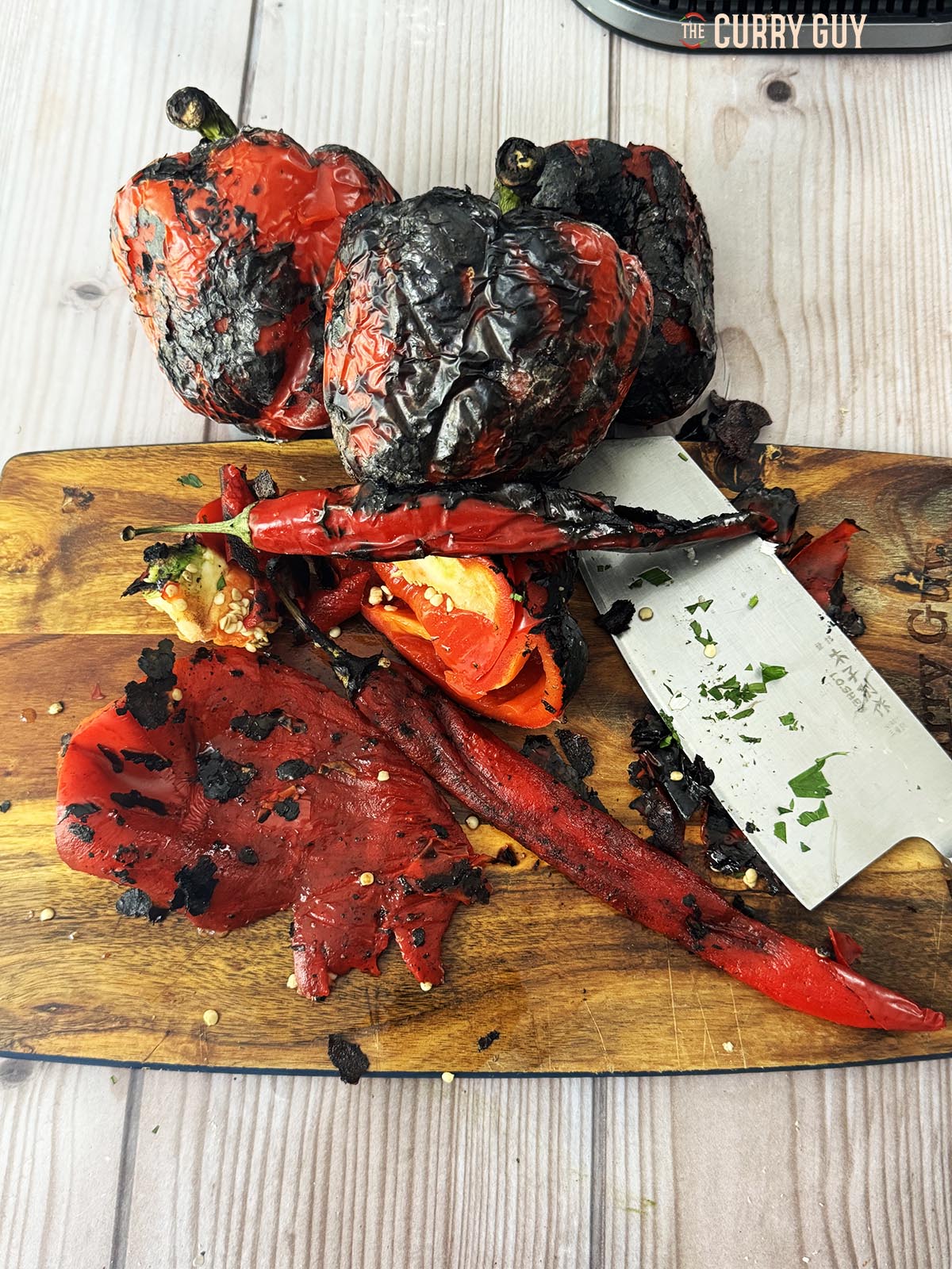 Peeling the black skin off the peppers.