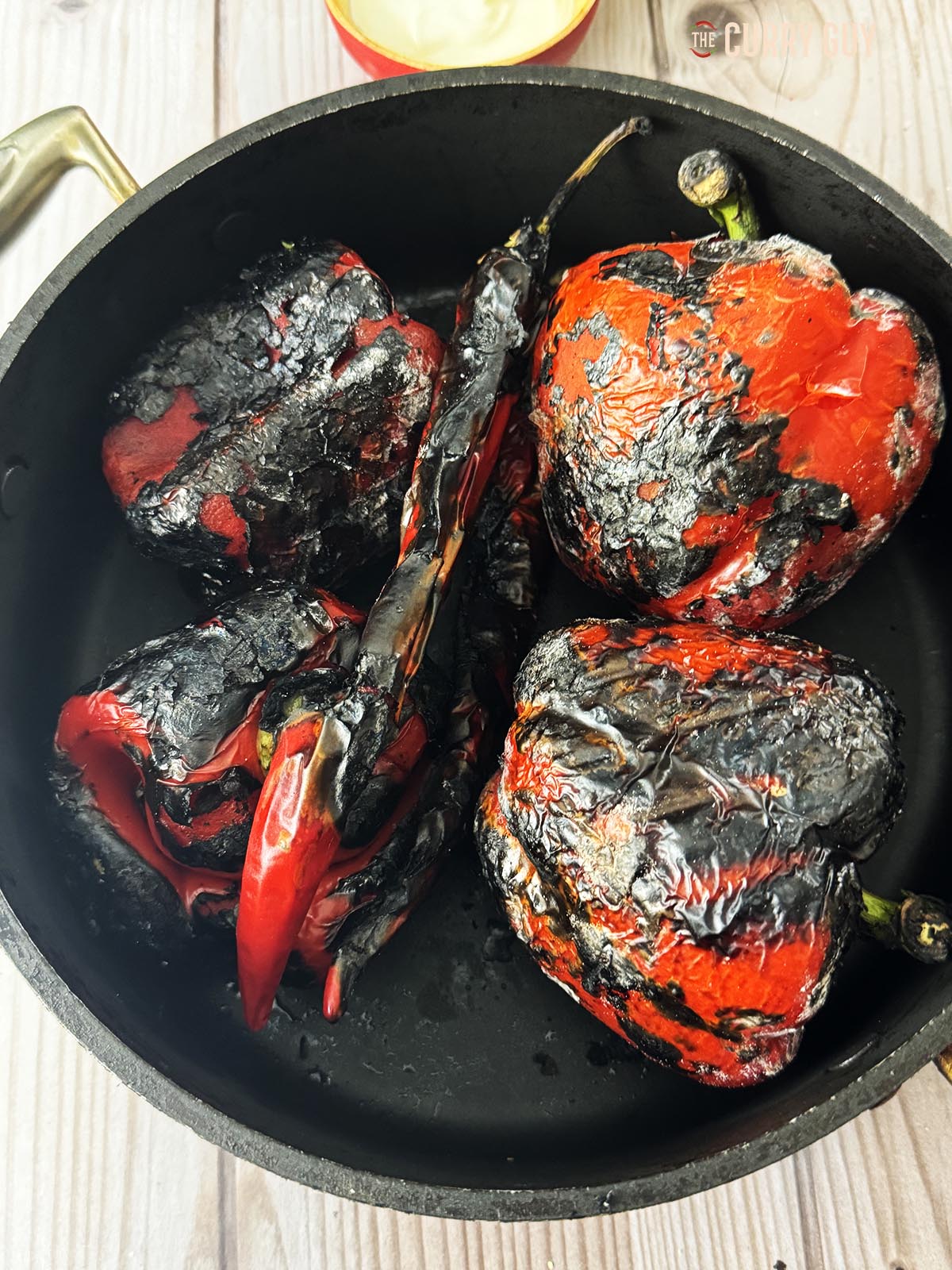 The roasted chillies after cooking and blackening over fire.