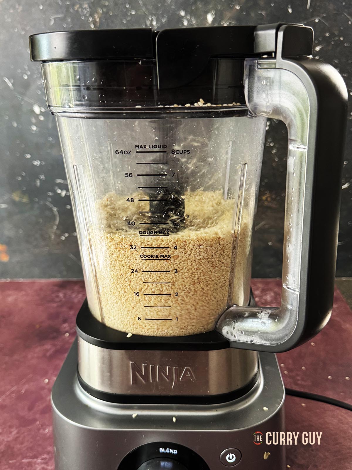 Grinding the sesame seeds in a food processor.