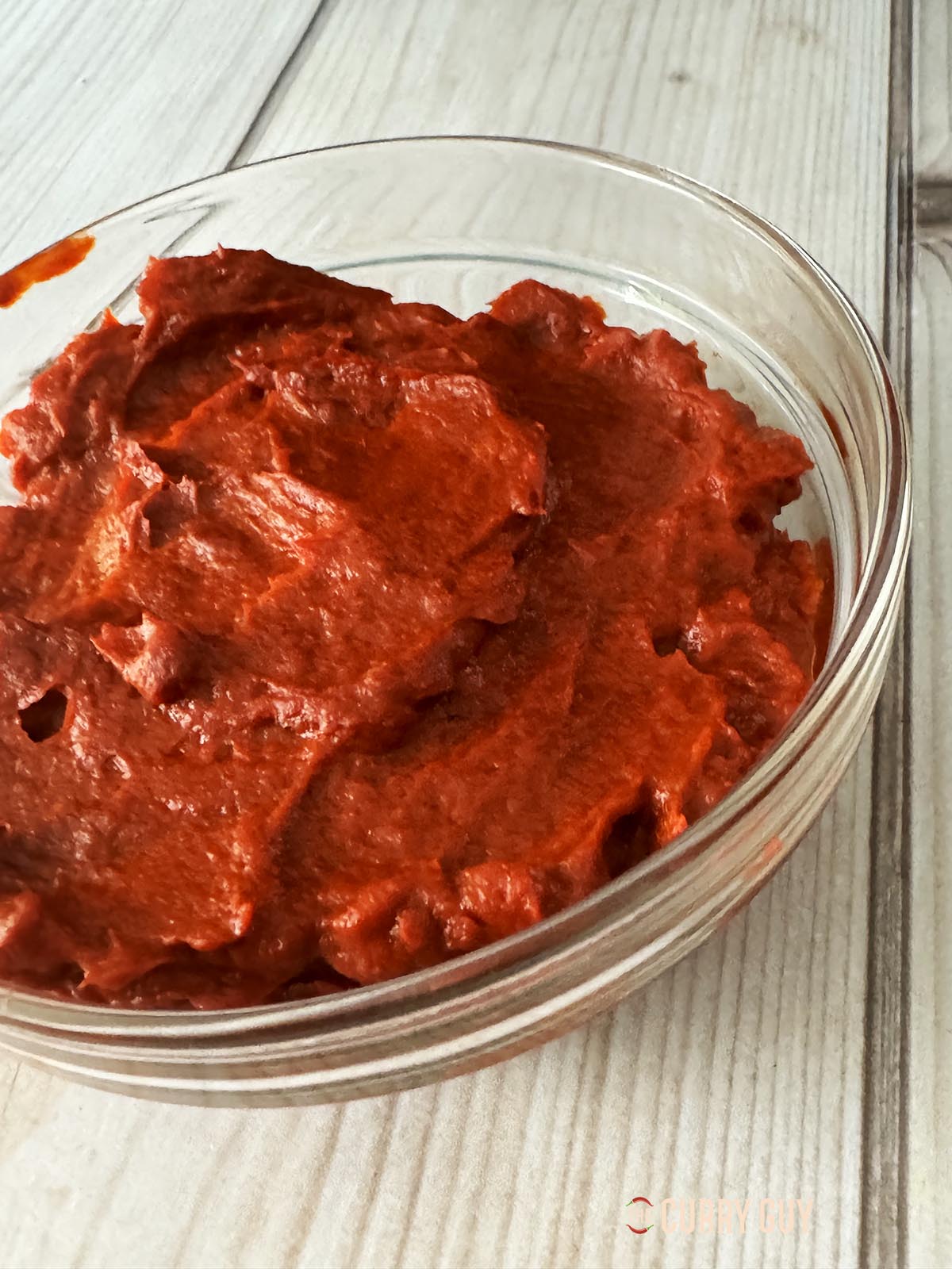 Turkish red pepper paste in a glass bowl.