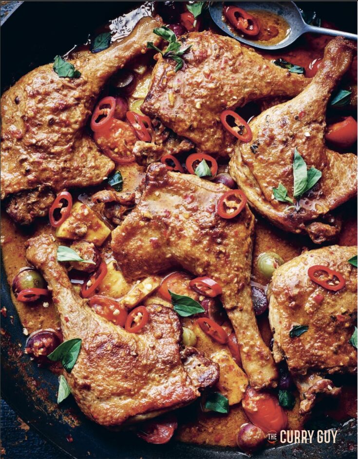 Red duck Thai curry in the pan it was cooked in.