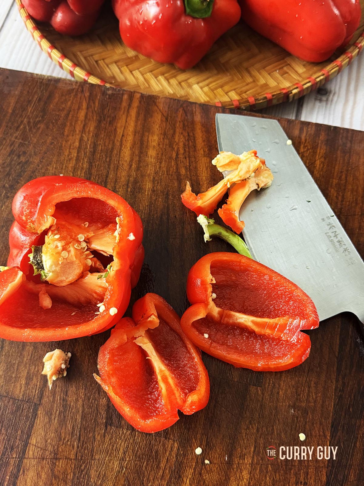 Deseeding the bell peppers.