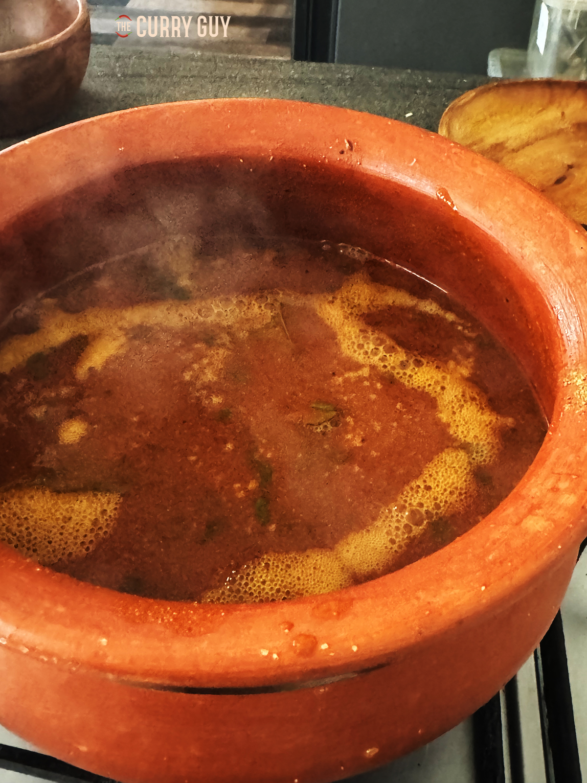 Simmering the tomato shorba before seasoning with salt and pepper. 