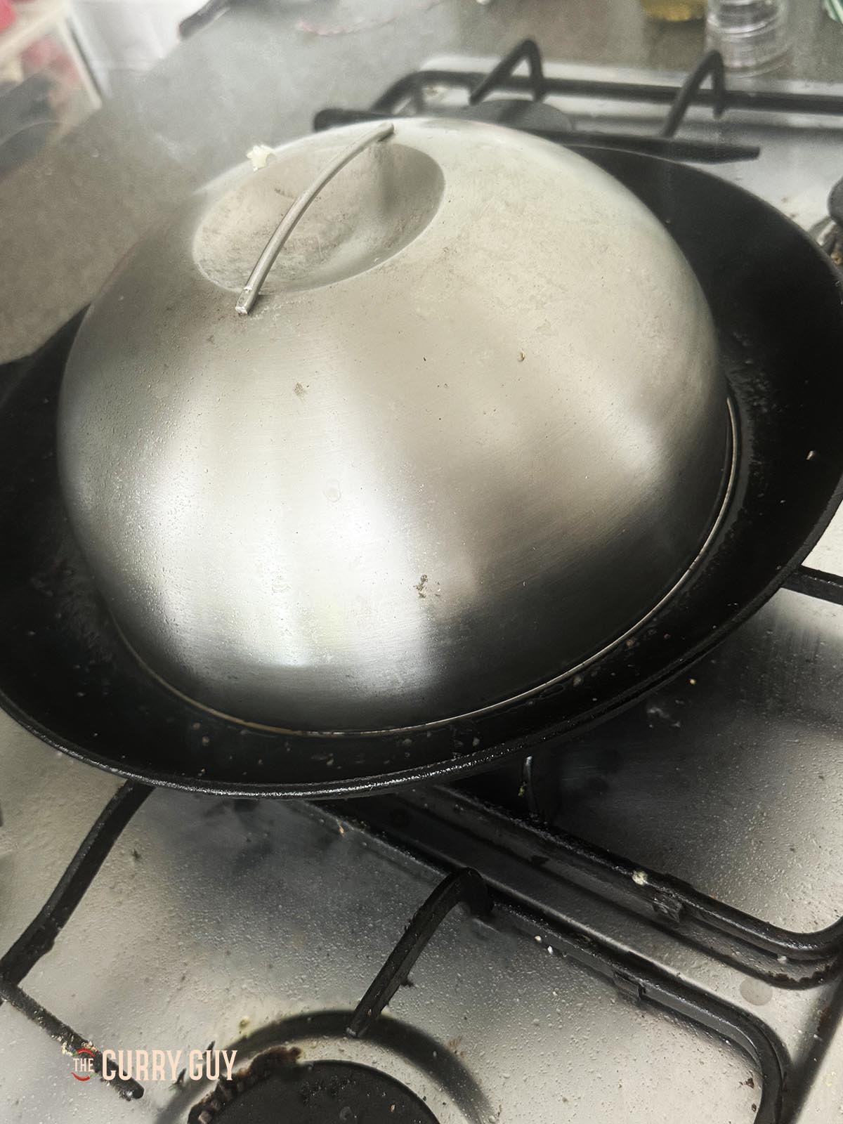 Adding the dome again to the burger to help steam the bun.