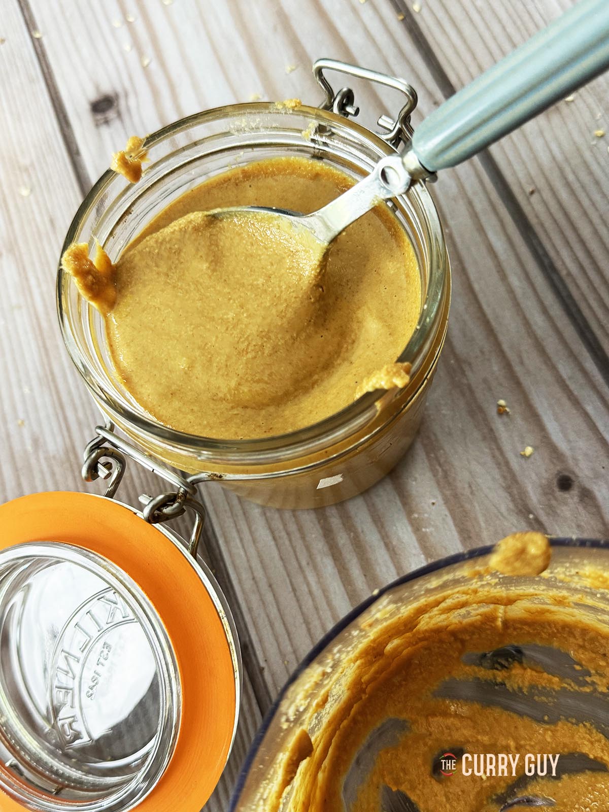The tahini in a glass jar.