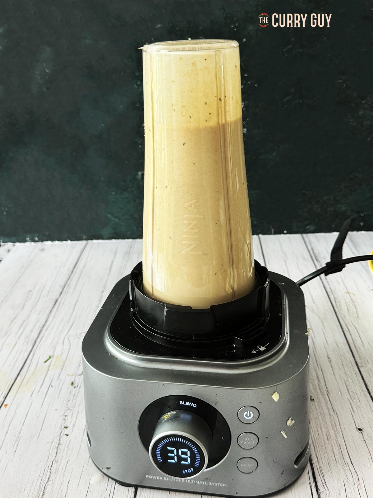 Blending the tahini sauce. 