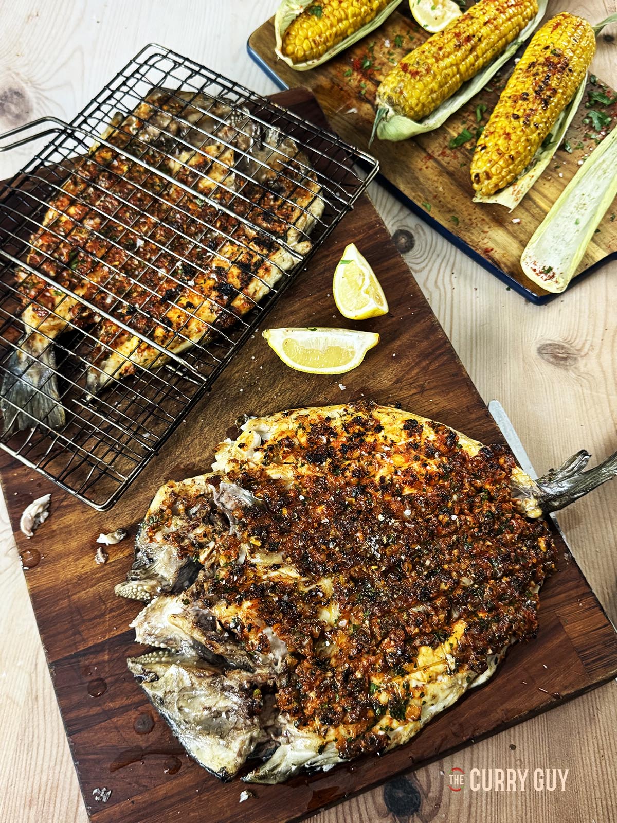 The grilled fish on a serving board.