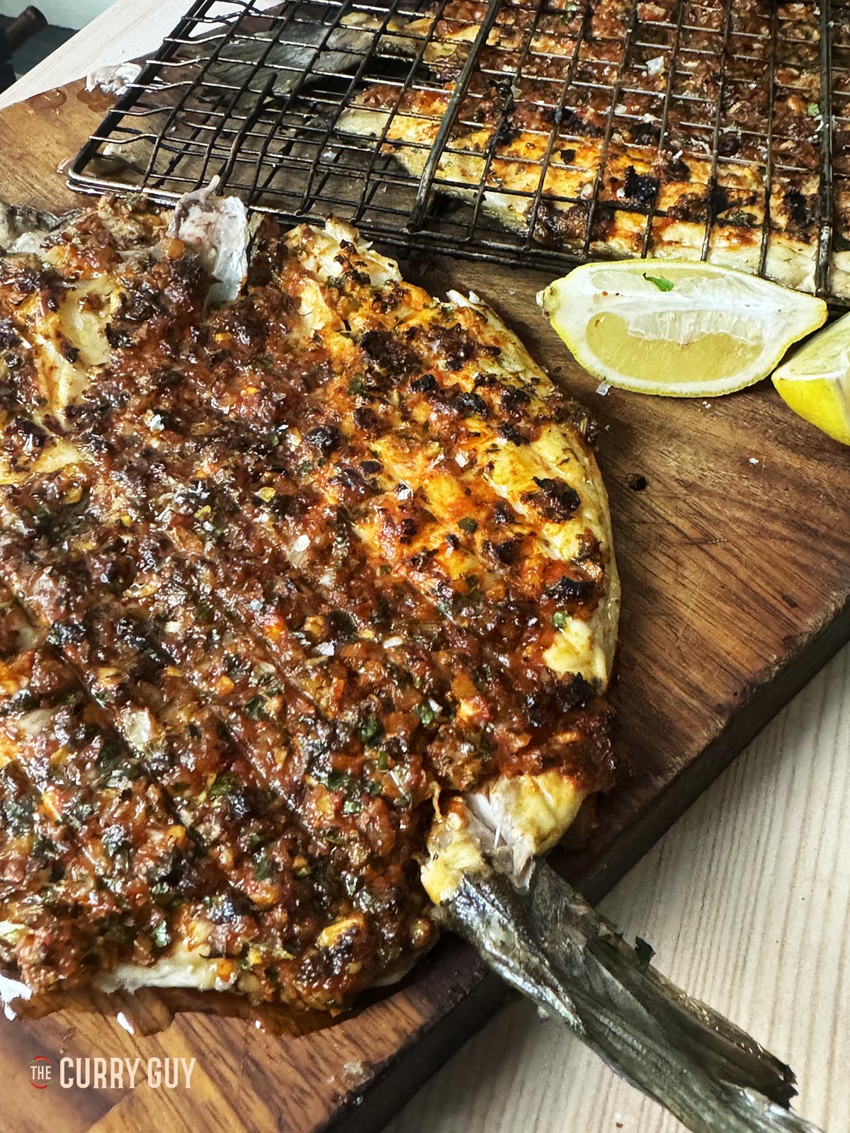 Mediterranean grilled fish on a serving platter. 
