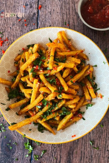 Masala fries served in a bowl.