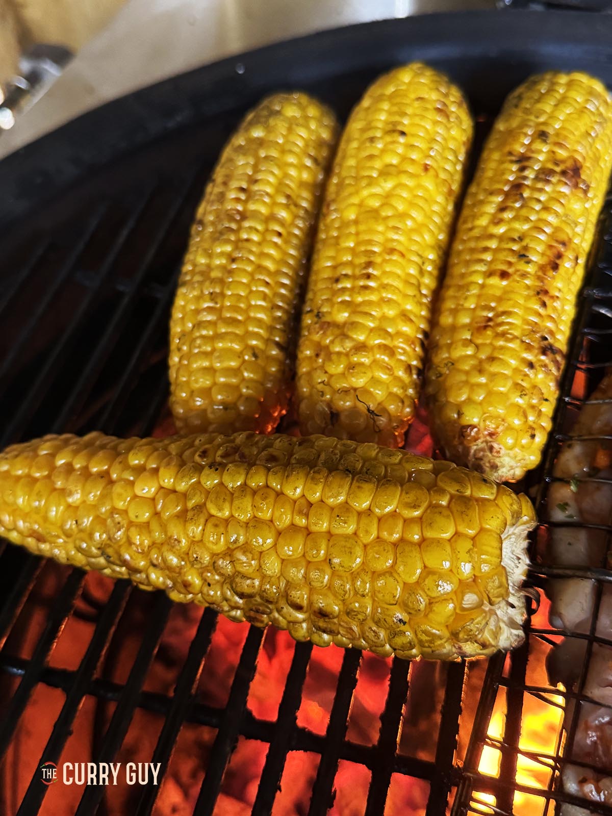 The corn charred on the grill and cooked through.