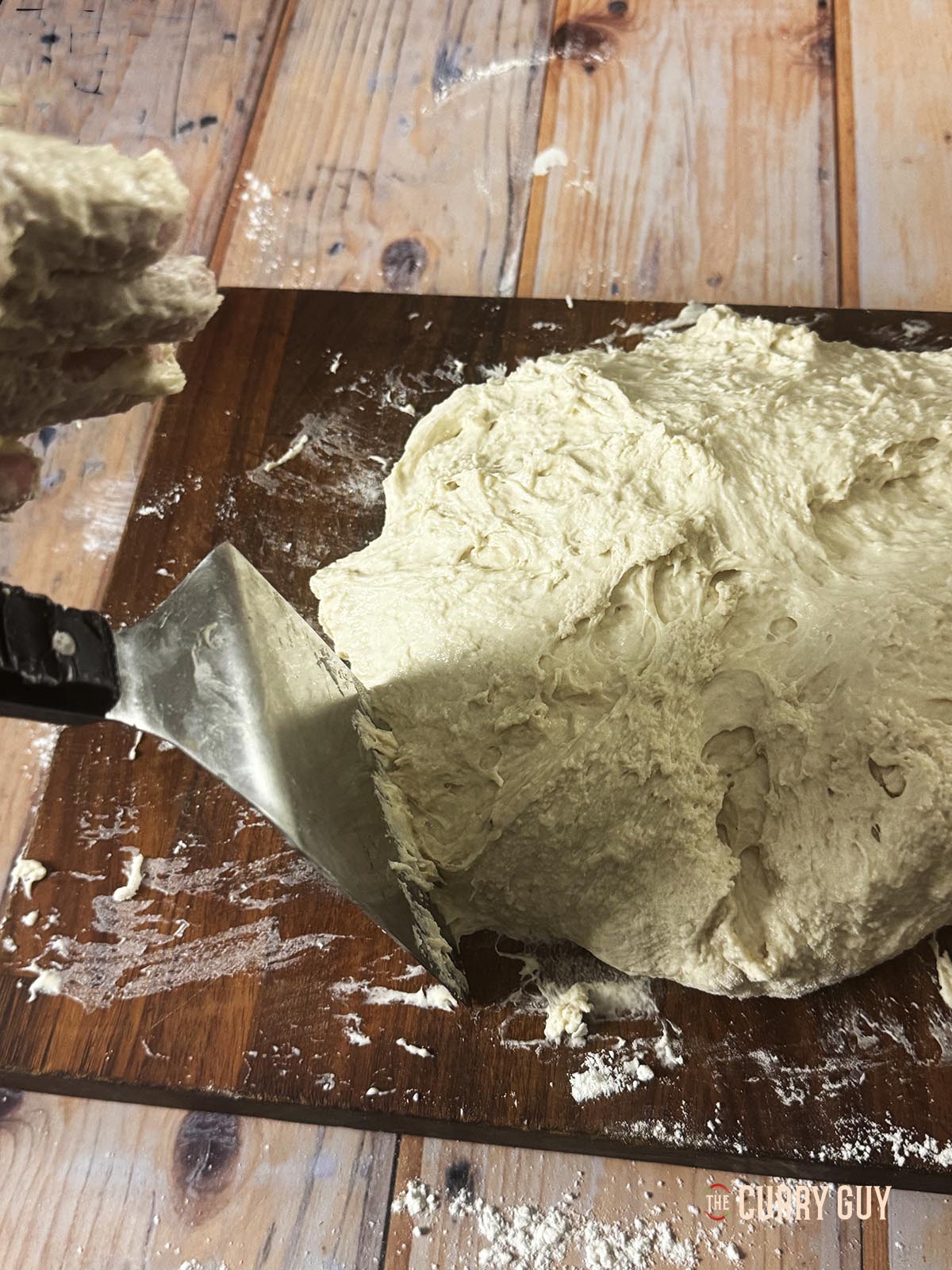 Kneading the dough into a smooth ball. 