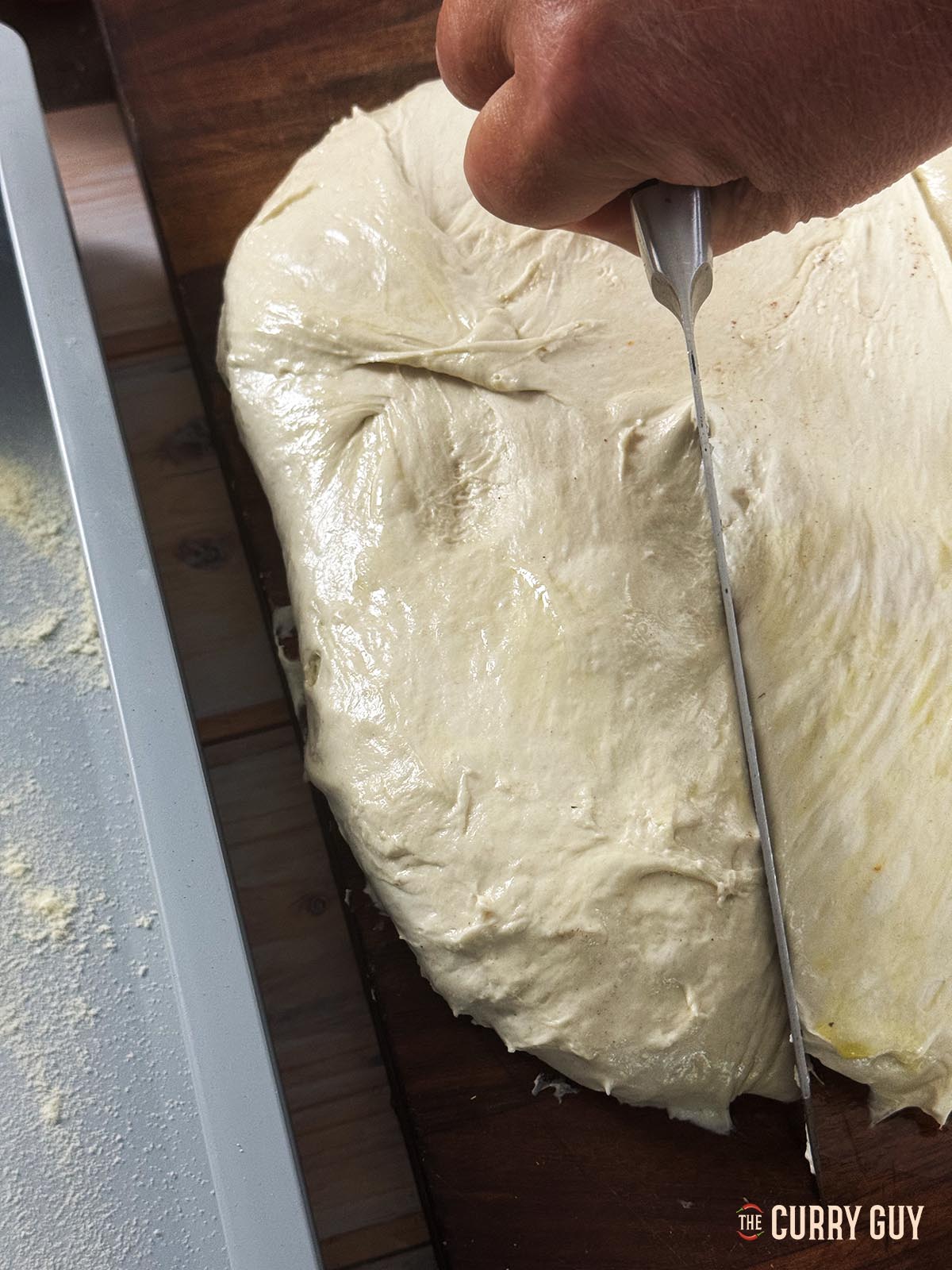 Dividing the dough with a knife.