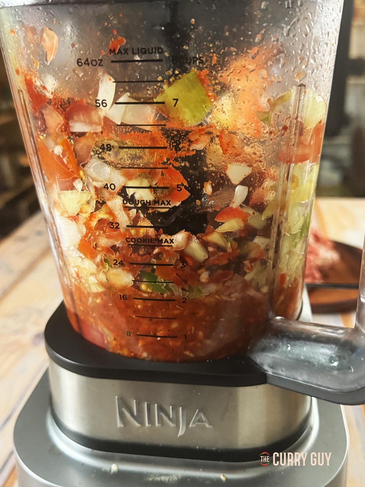 Pulsing the vegetables and spices in a blender. 
