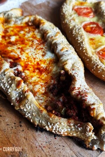 Turkish pide - one meat pide next to a cheese pide.