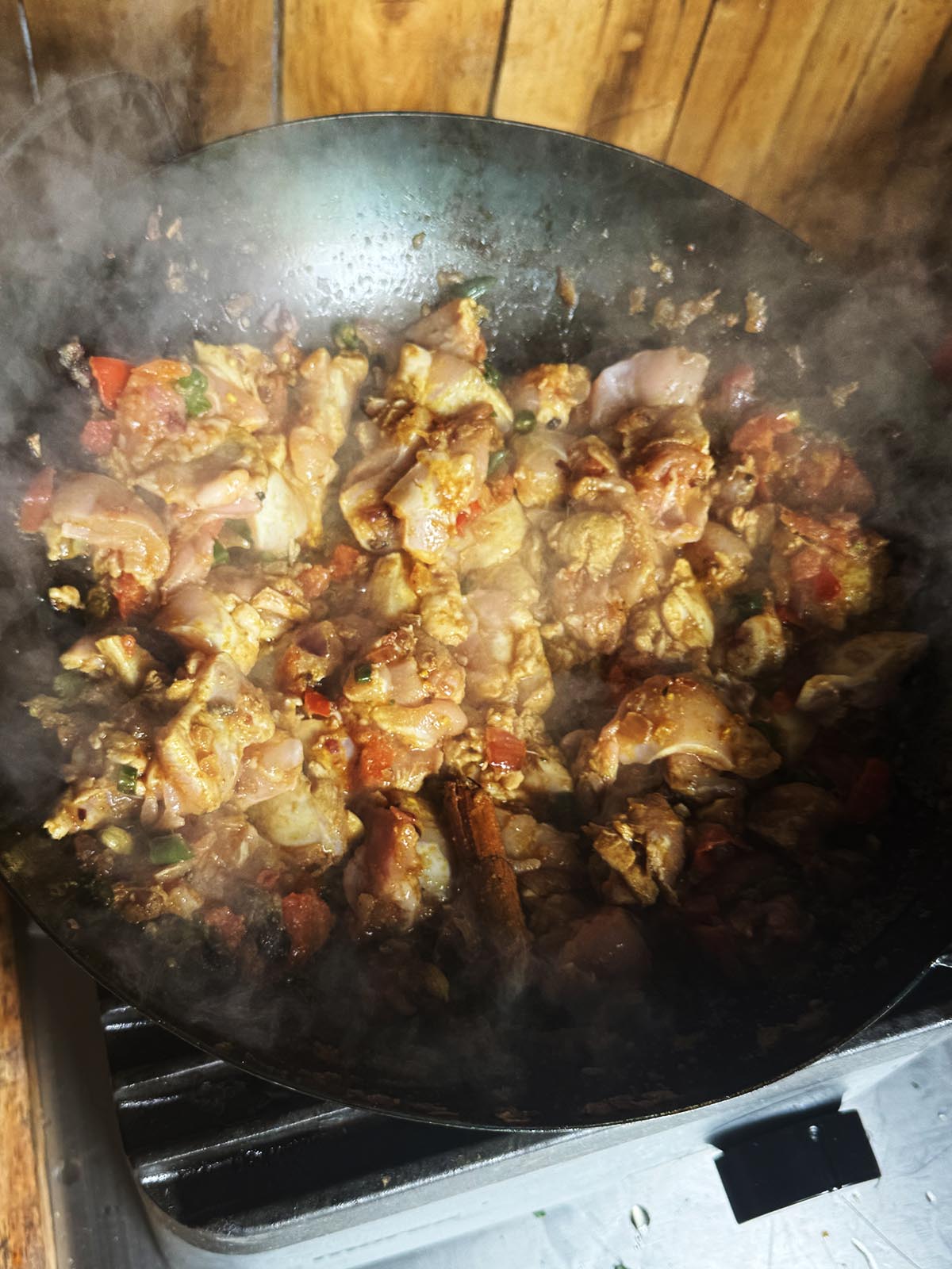 Stirring the chicken into the base blend.