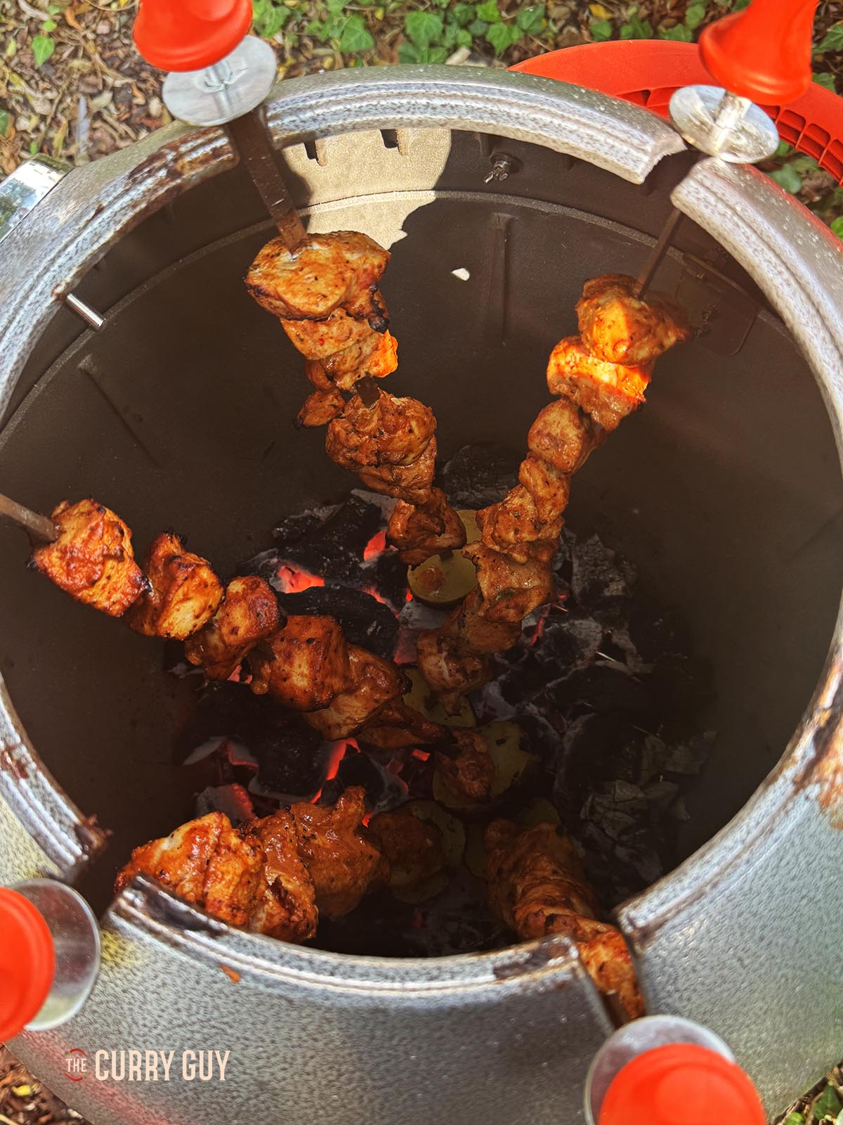 The cooked Turkish chicken kabobs on a tandoor, ready to serve.