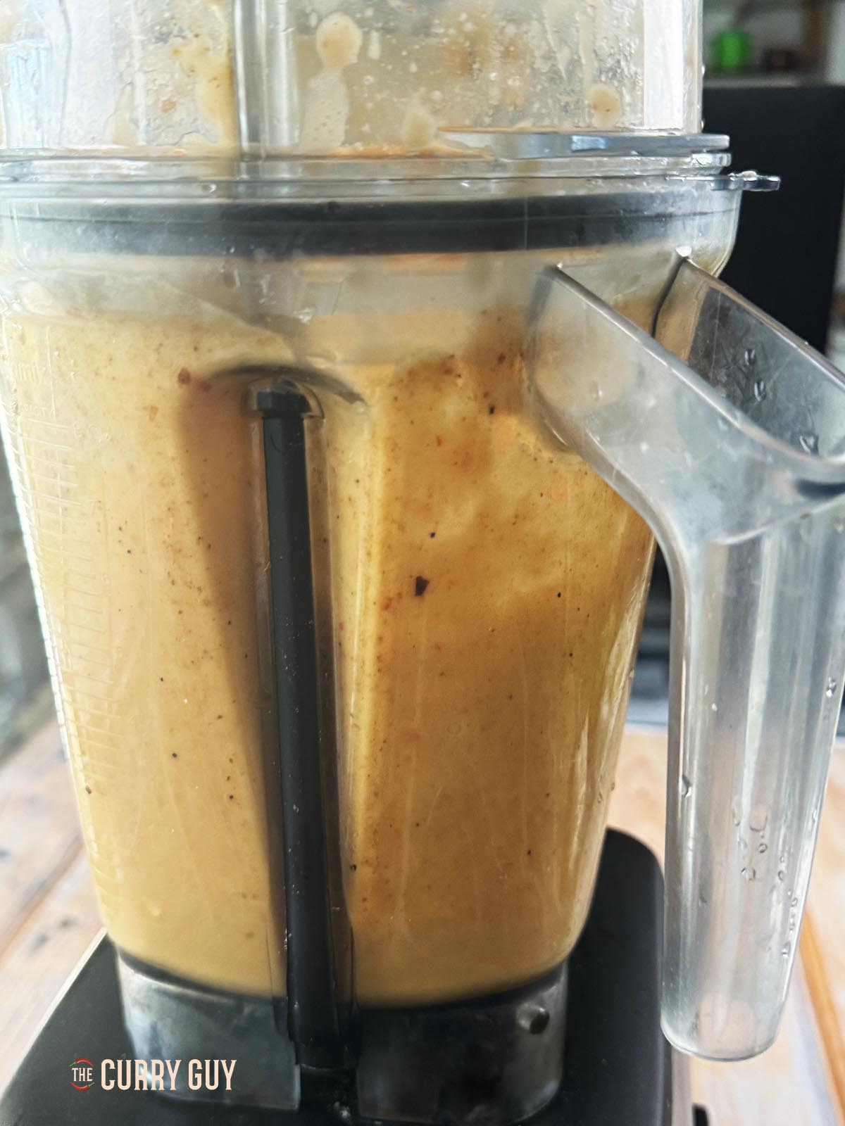 Blending the onions, bell peppers, carrot and garlic and ginger paste until smooth.