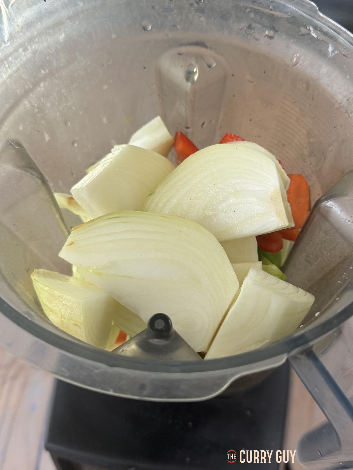The onions, bell peppers and garlic and ginger paste in a blender.