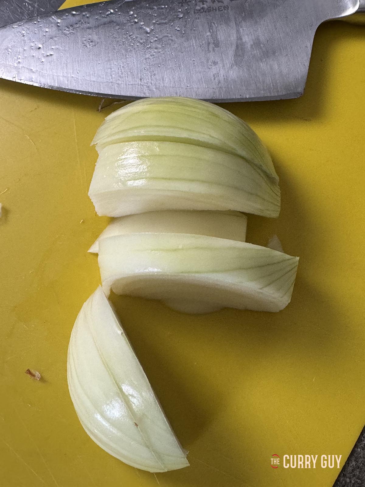 A onion sliced and ready for blending.