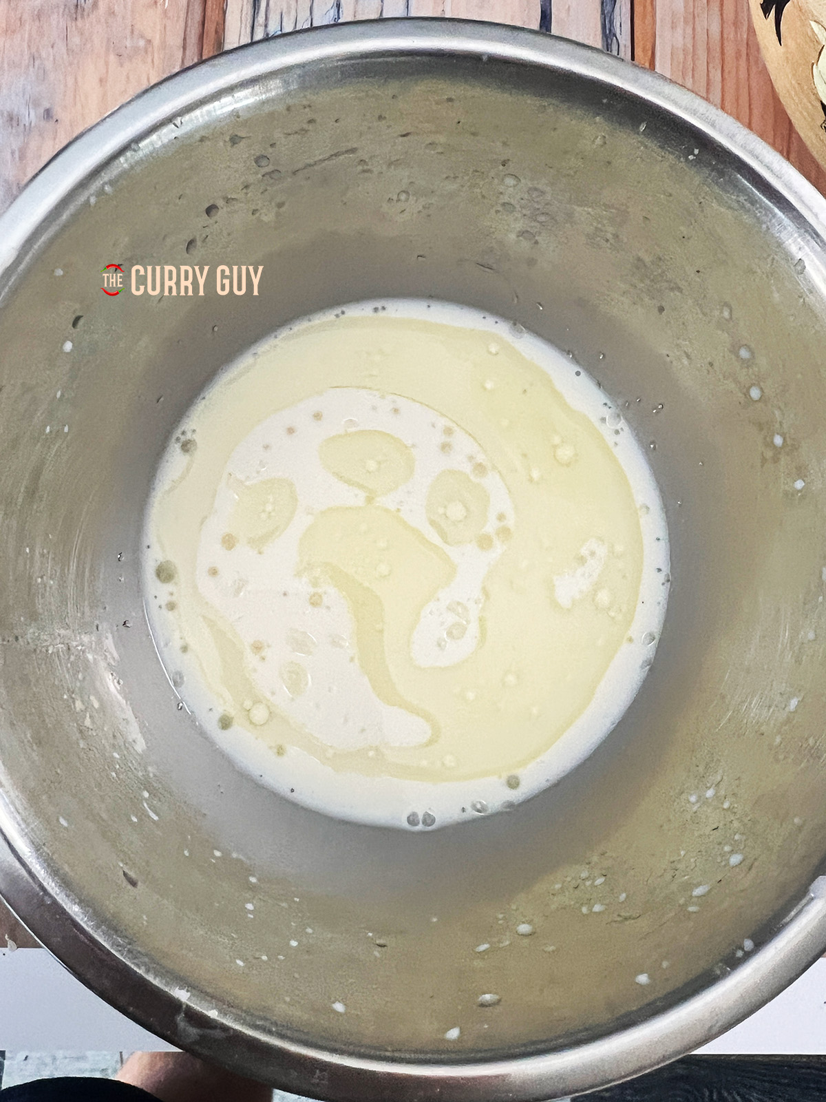 Wet ingredients for the Bao recipe added to the bowl.