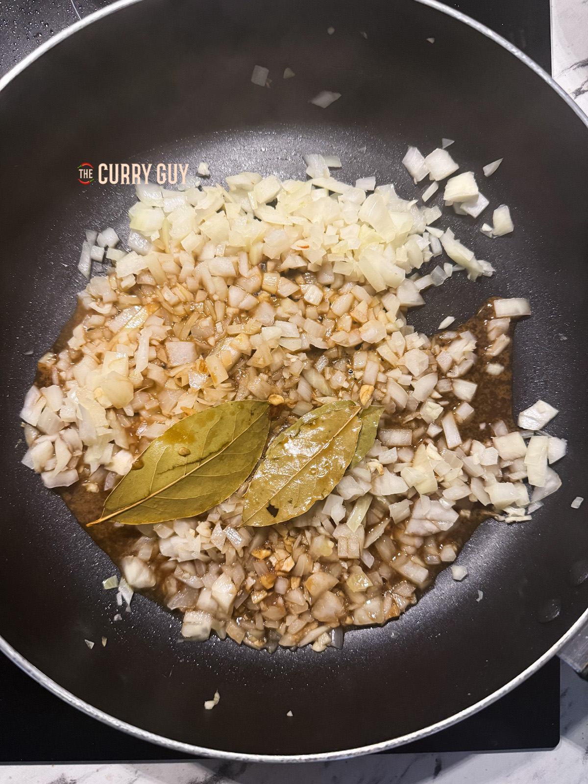 sauce added to the pan with onions for chicken adobo