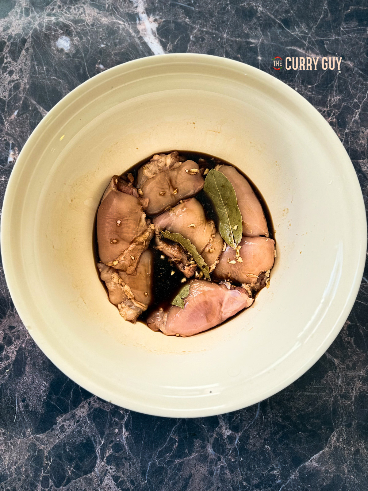 marinade and the chicken in a bowl. 