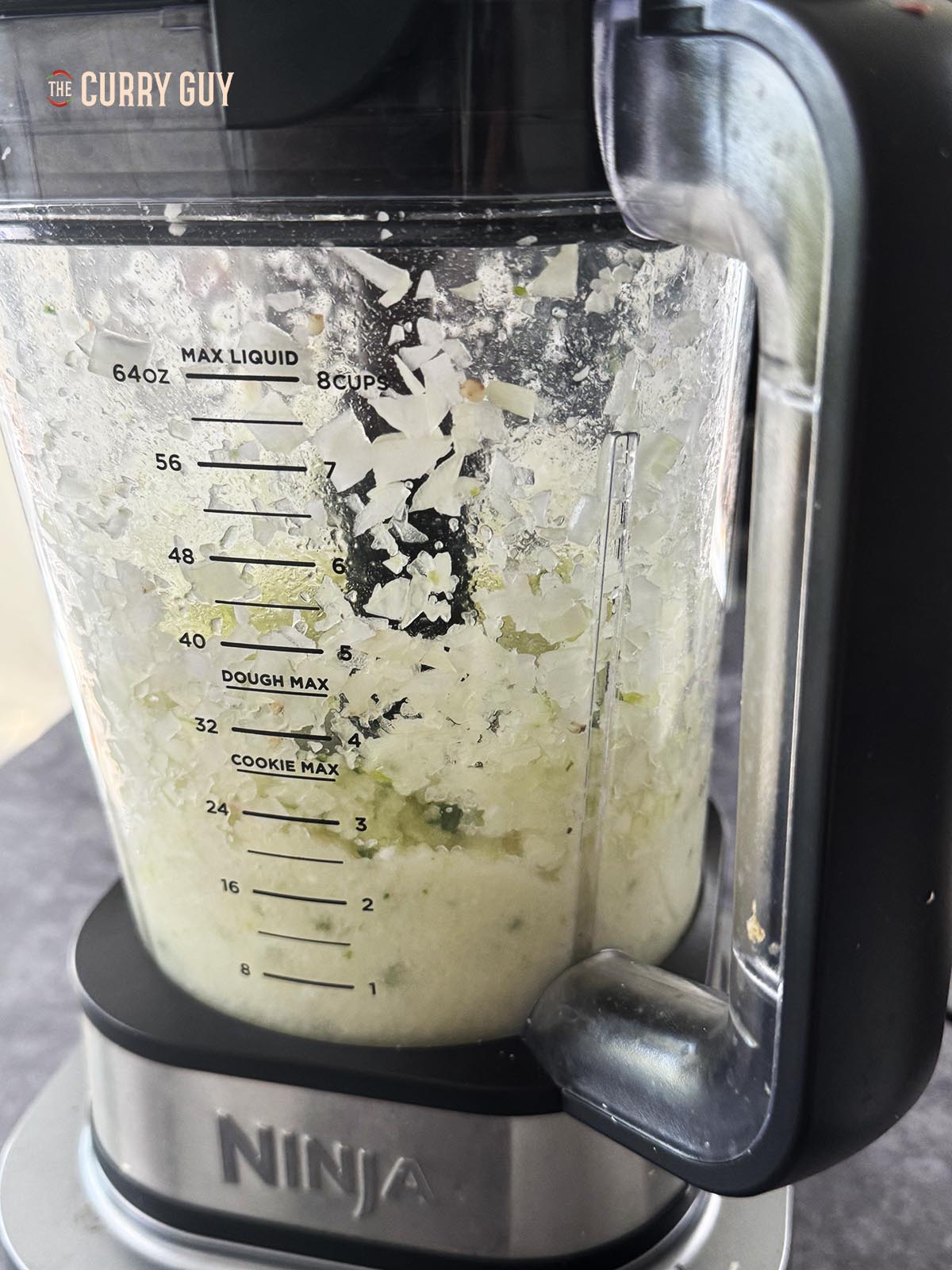 Blending the onions and chillies in a blender until smooth.