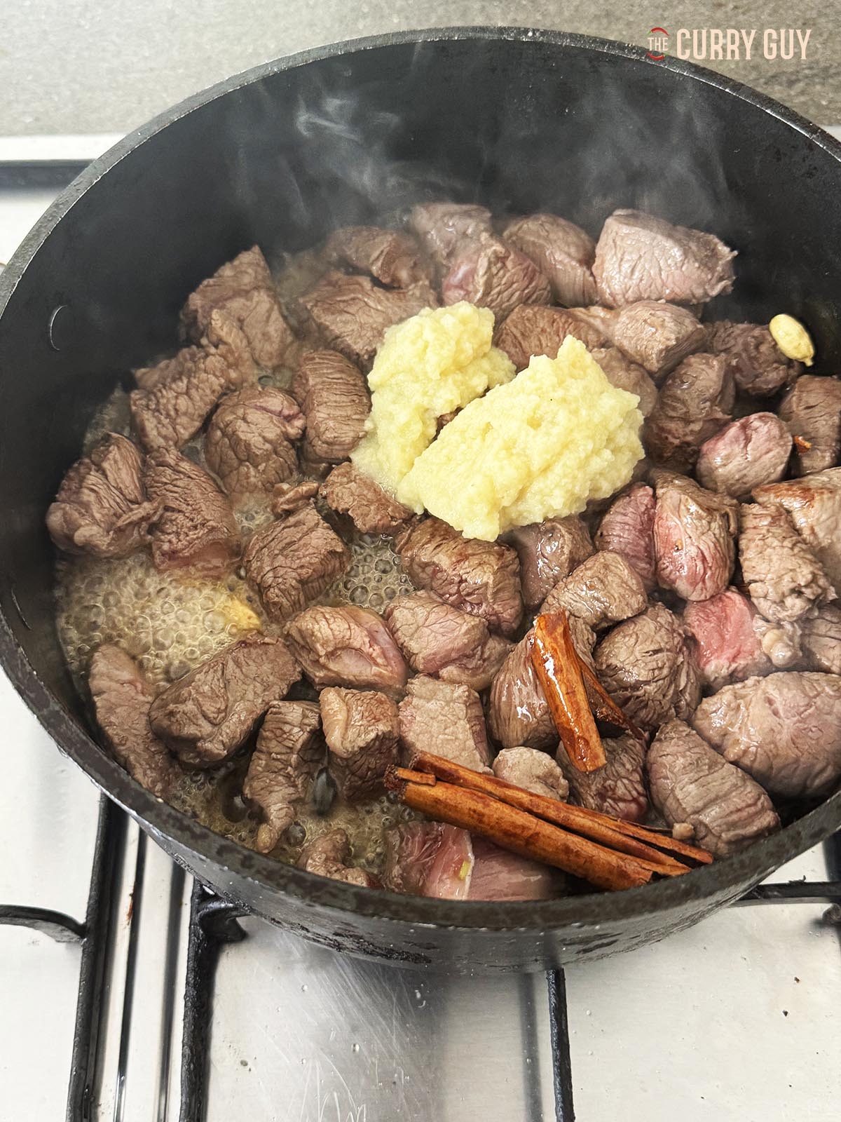 Browing the meat and then adding the garlic and ginger paste.