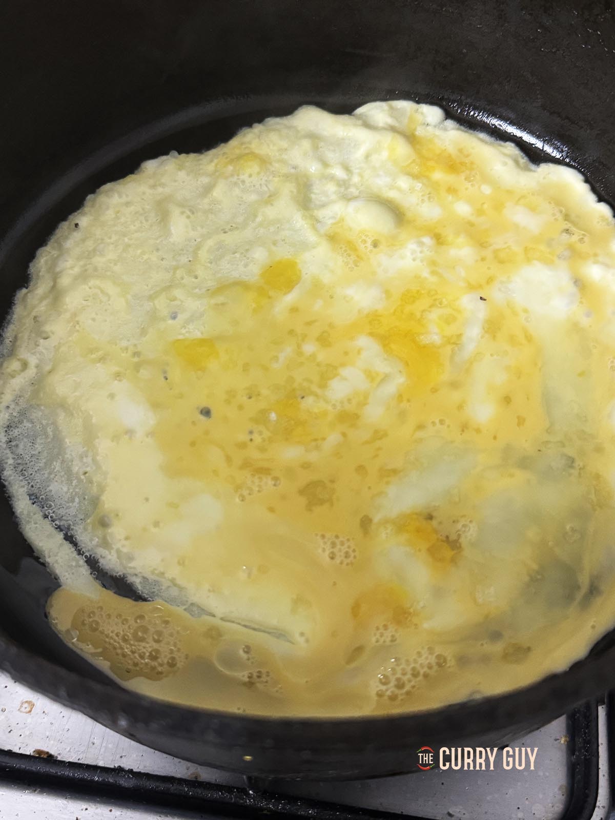Cooking the eggs in a pan.