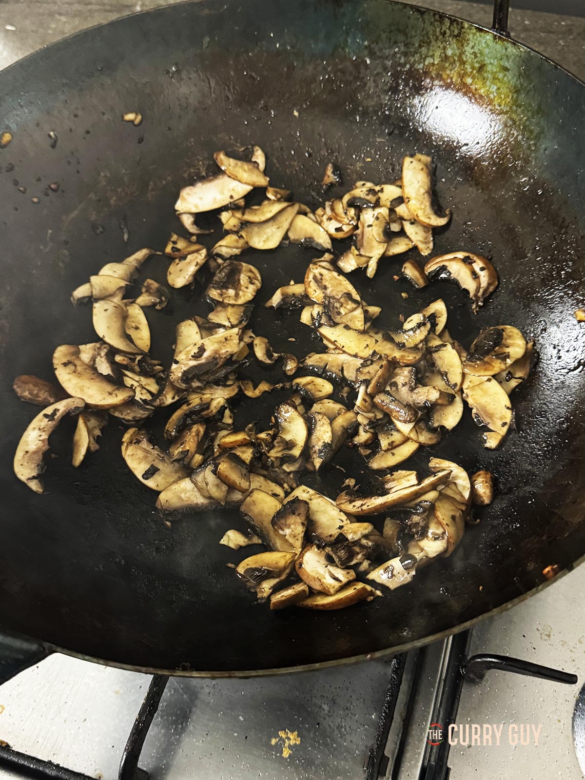 Frying the mushrooms.