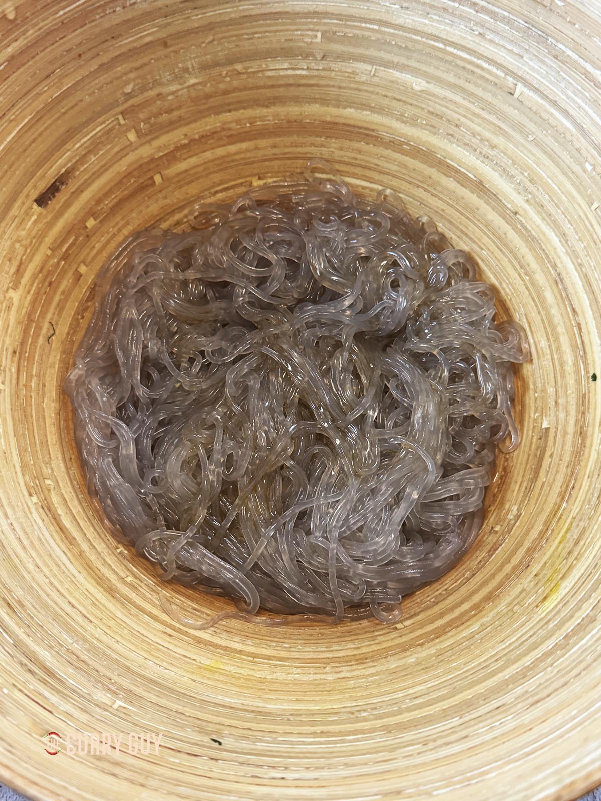 The cooked noodles in a bowl, ready to add to the japchae.