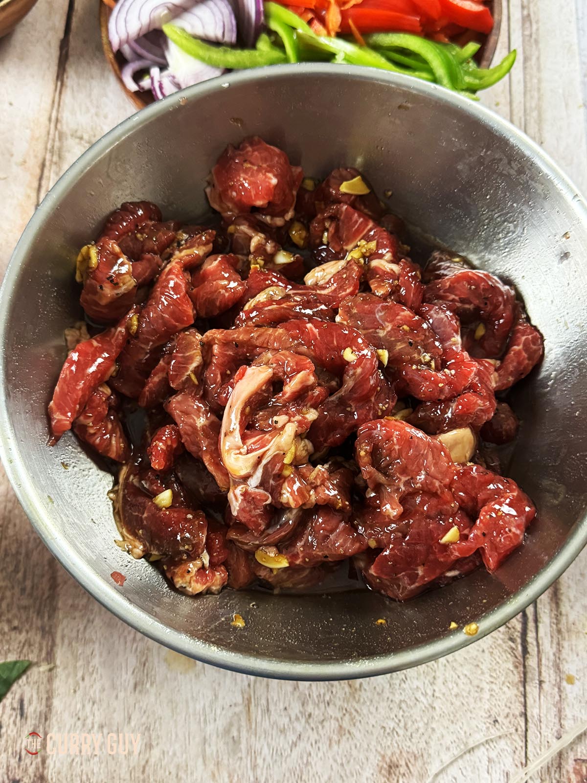 The meat marinating in the marinade.