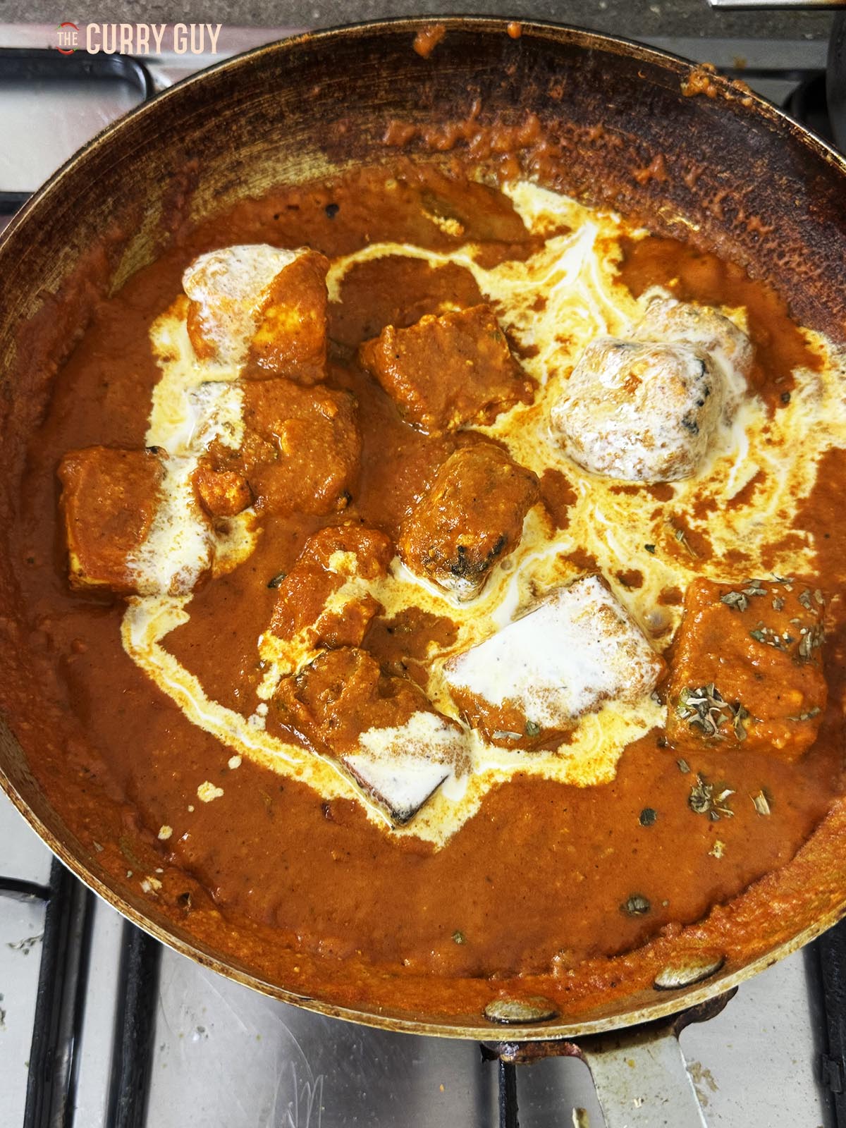 Adding the cream to the pan.