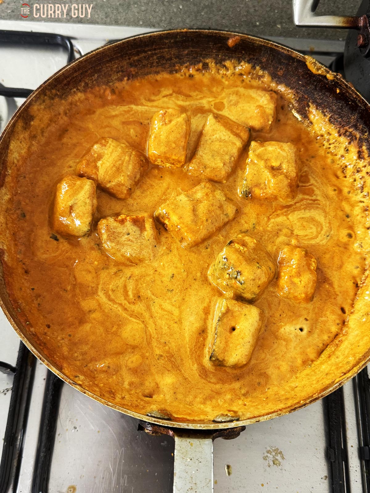 The cream stirred into the sauce.