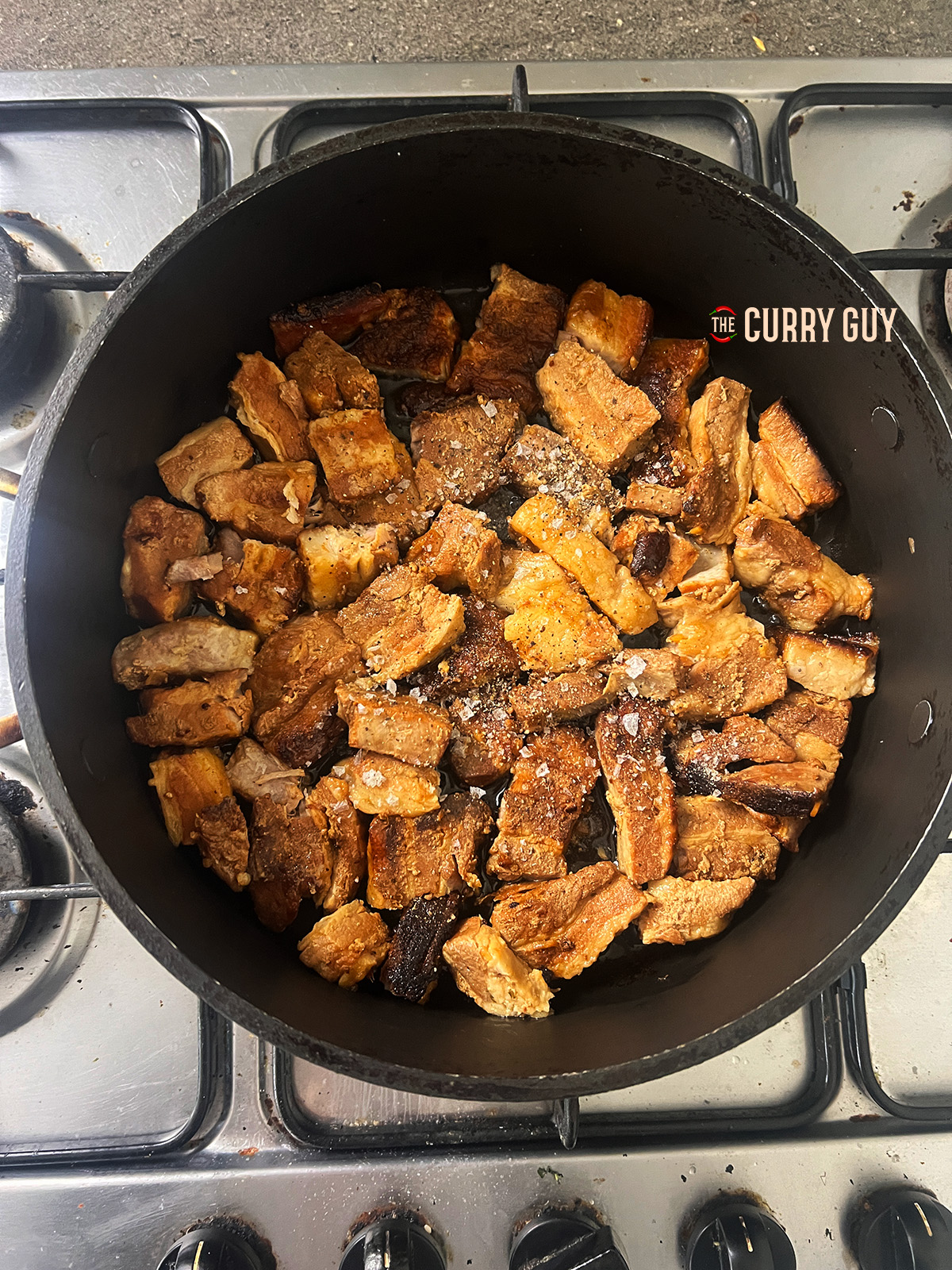 pork belly in a pan turning golden for pork belly bao