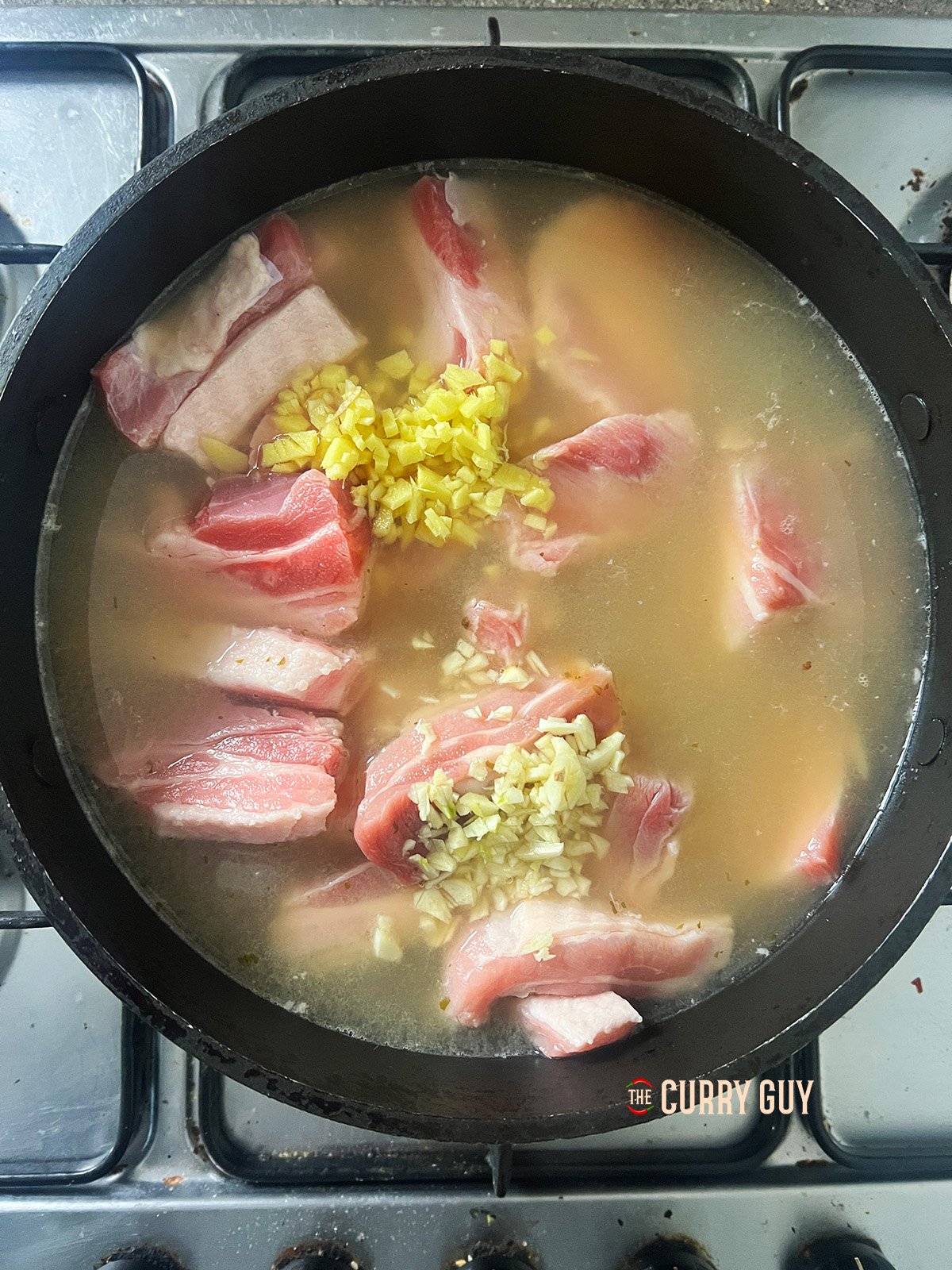 Sow cooked pork ingredients in a pan.