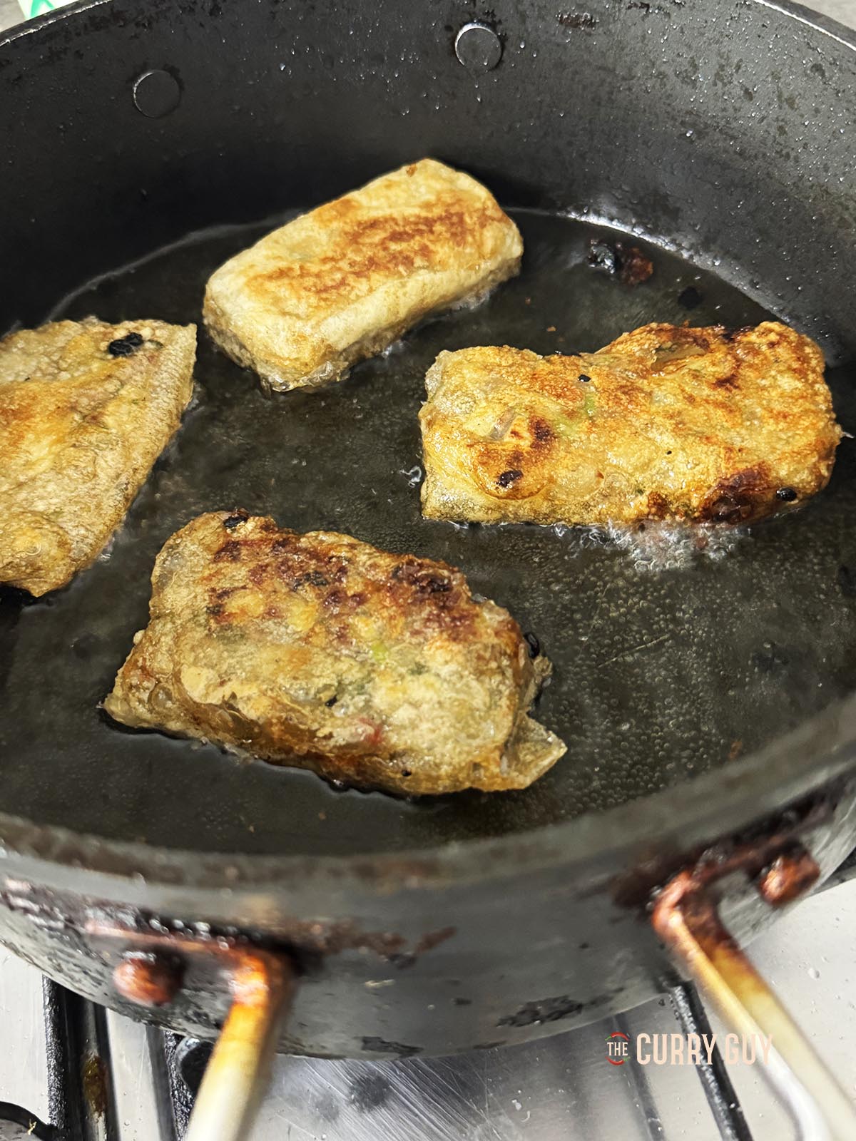 The rice paper dumplings frying until golden brown.