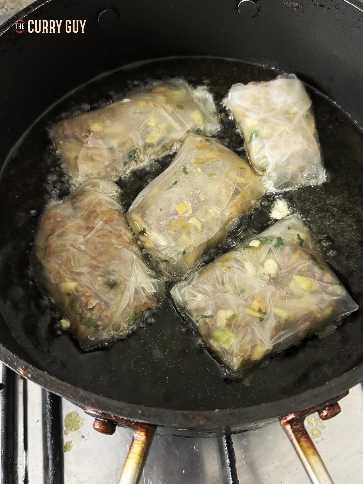 Frying the dumplings in a pan.