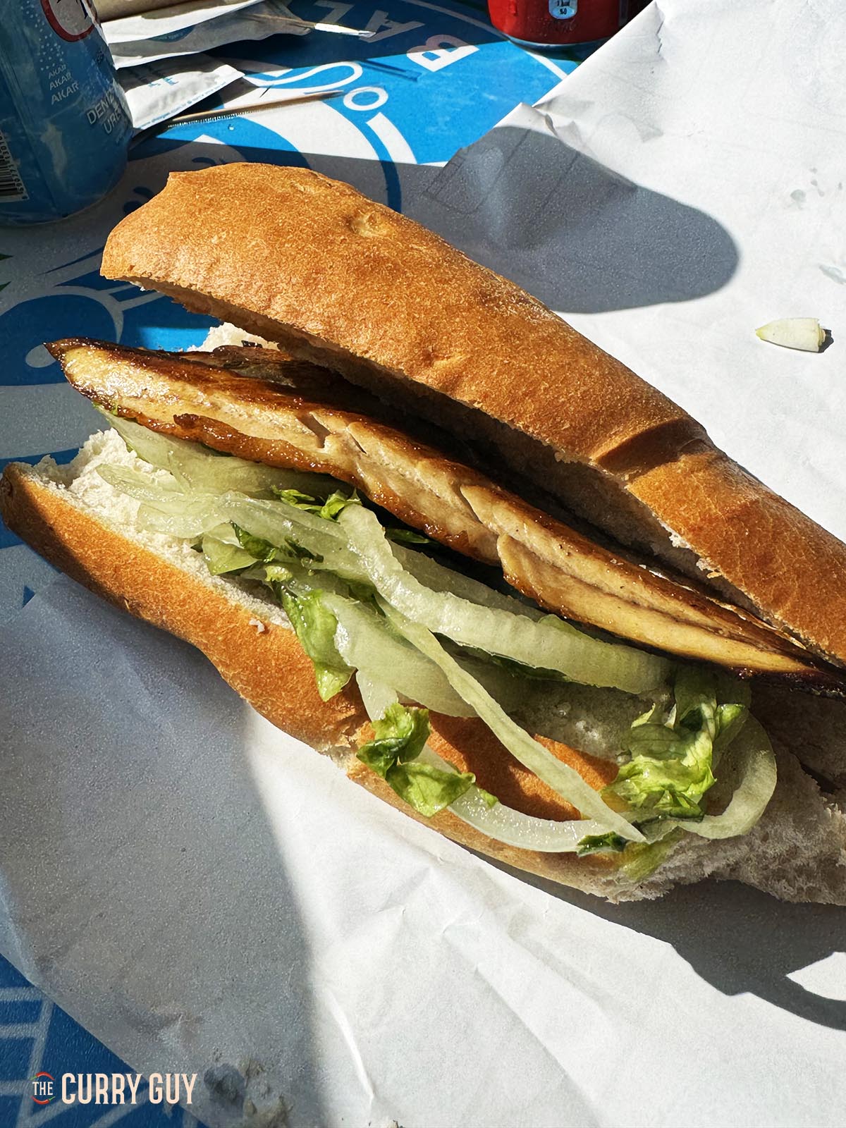 A Turkish fish sandwich on paper.