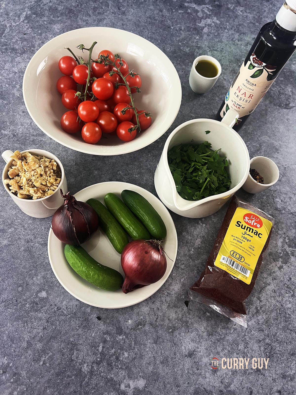 The ingredients for the salad laid out on a counter top.