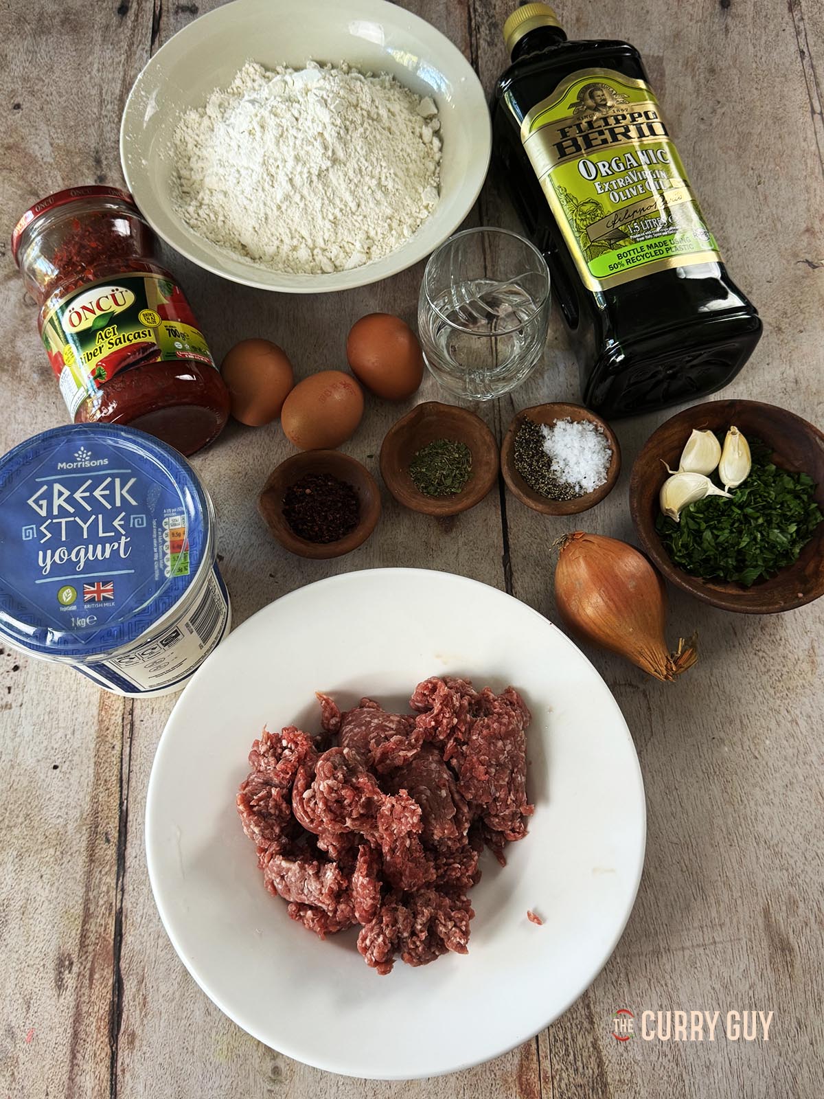 Ingredients for the recipe laid out on a countertop ready to start cooking.
