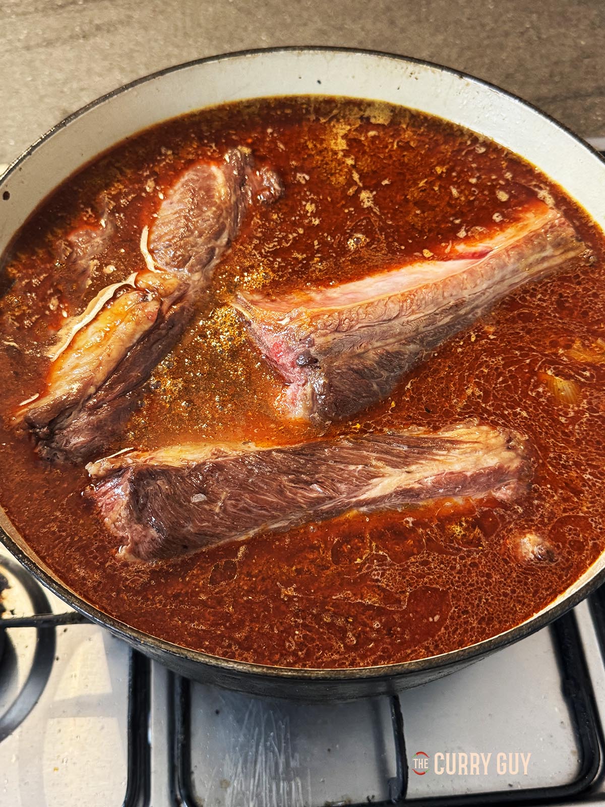 The beef ribs added to the pot with enough water to cover. 
