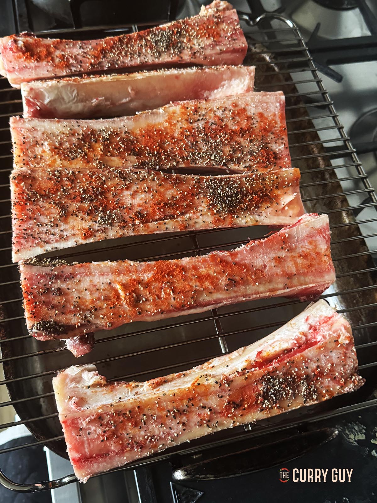 The prepared beef marrow bones, seasoned and ready to roast in the oven. 