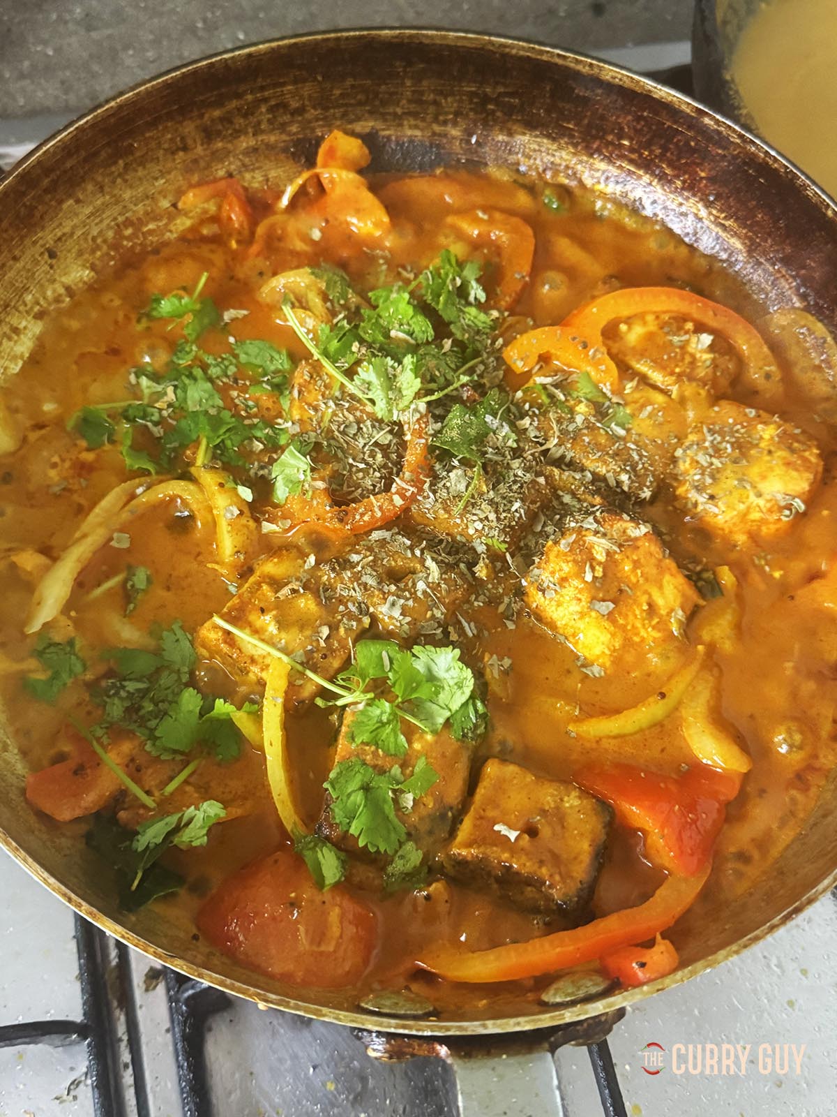 Adding the kasoori methi to the pan.