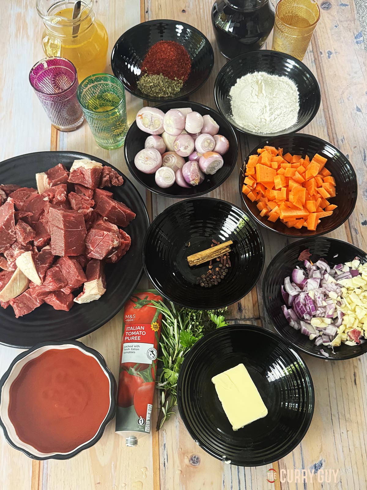 Ingredients for the recipe laid out on a countertop ready to start cooking.