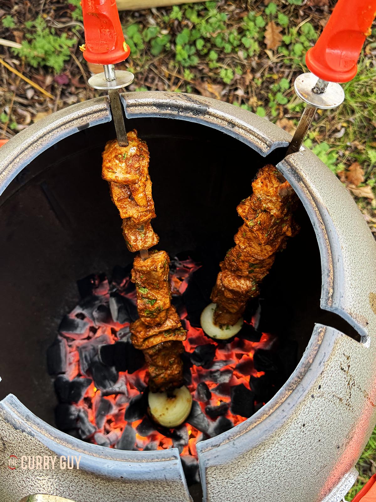 The cooked salmon tikka in a tandoor oven.