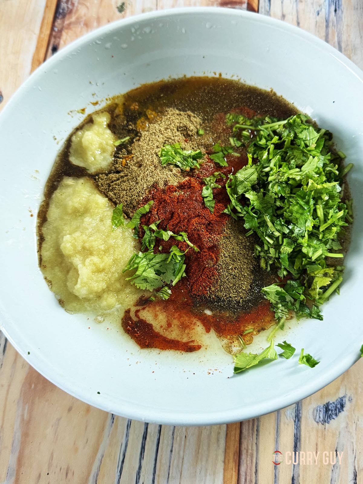 The marinade ingredients in a mixing bowl, whisked until smooth.