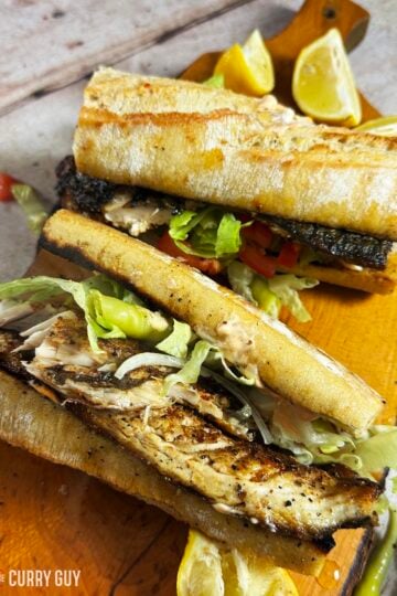 Turkish fish sandwich on a serving board.