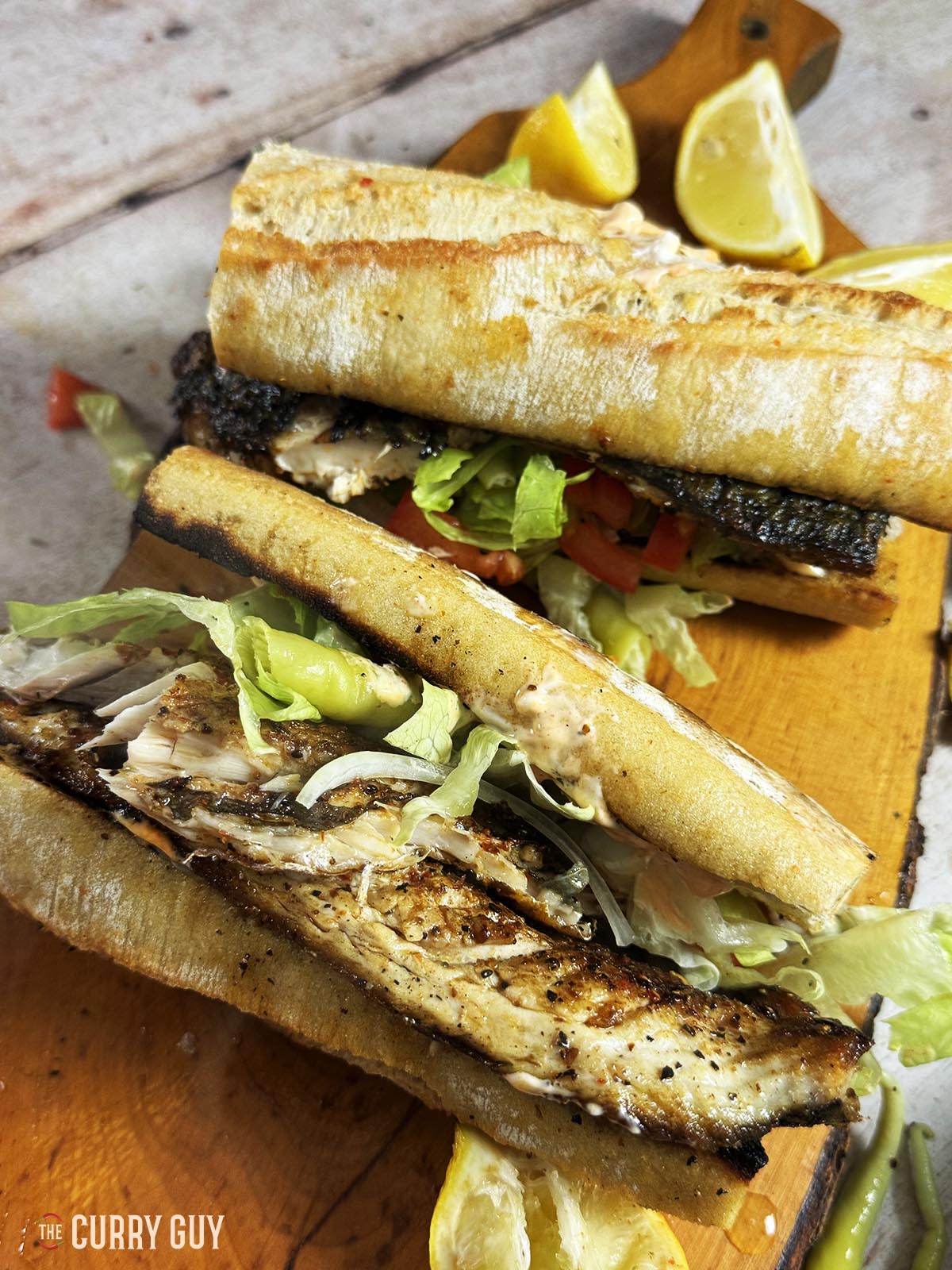 Turkish fish sandwich on a serving board.